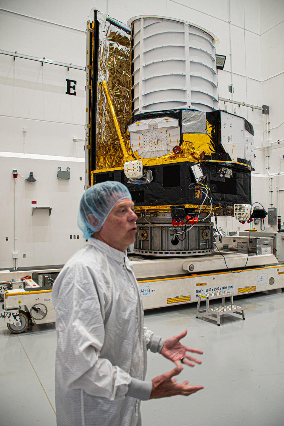 Giuseppe Racca, the Euclid project manager, describes the space telescope to a reporter in a 