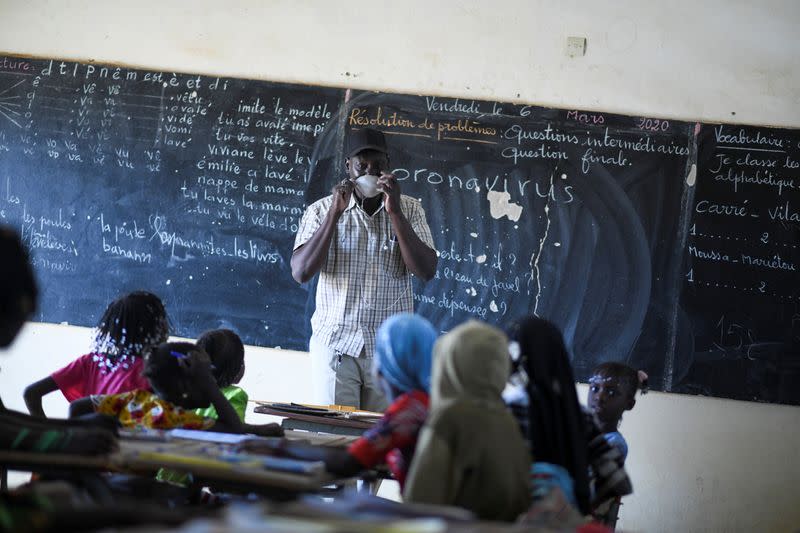 Abacar Sy, director of an elementary school, gives an awareness course about coronavirus at his classroom in Haliouri village, near Matam