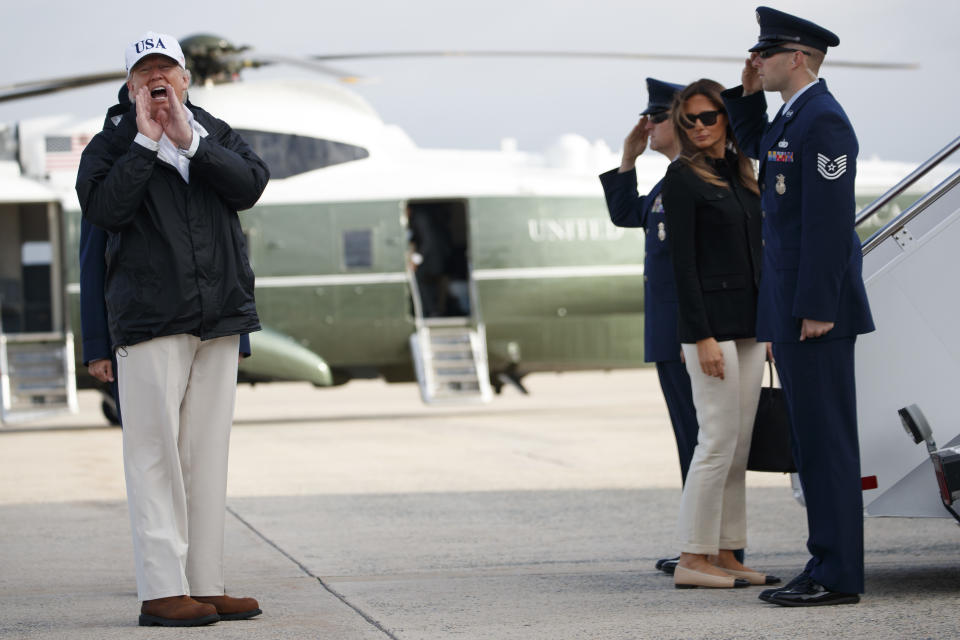 <p>President Donald Trump responds to a reporters question as he boards Air Force One with first lady Melania Trump for a trip to Florida to meet with first responders and people impacted by Hurricane Irma, Thursday, Sept. 14, 2017, in Andrews Air Force Base, Md. ((Photo: Evan Vucci/AP) </p>