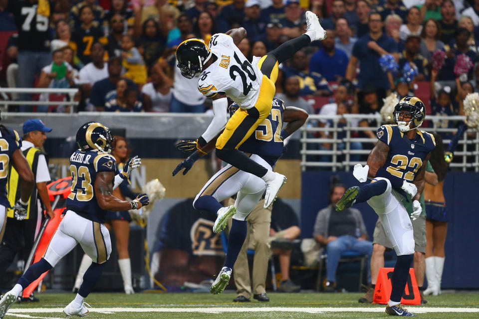 ST. LOUIS, MO - SEPTEMBER 27: Le'Veon Bell #26 of the Pittsburgh Steelers is tackled by Alec Ogletree #52 of the St. Louis Rams in the second quarter at the Edward Jones Dome on September 27, 2015 in St. Louis, Missouri.  (Photo by Dilip Vishwanat/Getty Images)