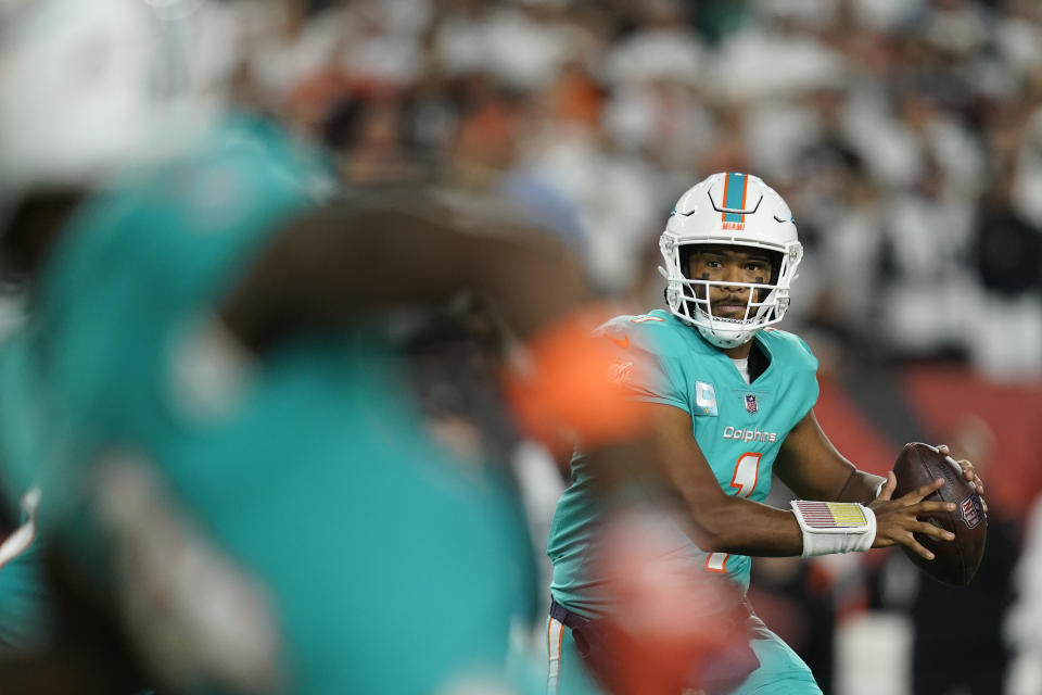 Miami Dolphins' Tua Tagovailoa (1) throws during the first half of an NFL football game against the Cincinnati Bengals, Thursday, Sept. 29, 2022, in Cincinnati. (AP Photo/Joshua A. Bickel)