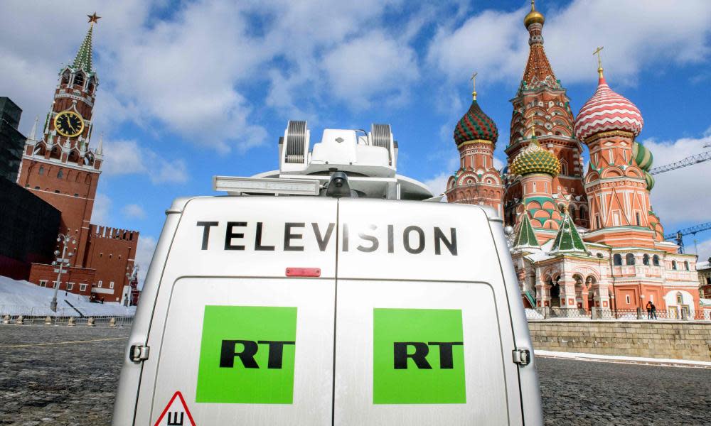 A Russia Today TV broadcast van in front of St Basil's Cathedral and the Kremlin next to Red Square in Moscow