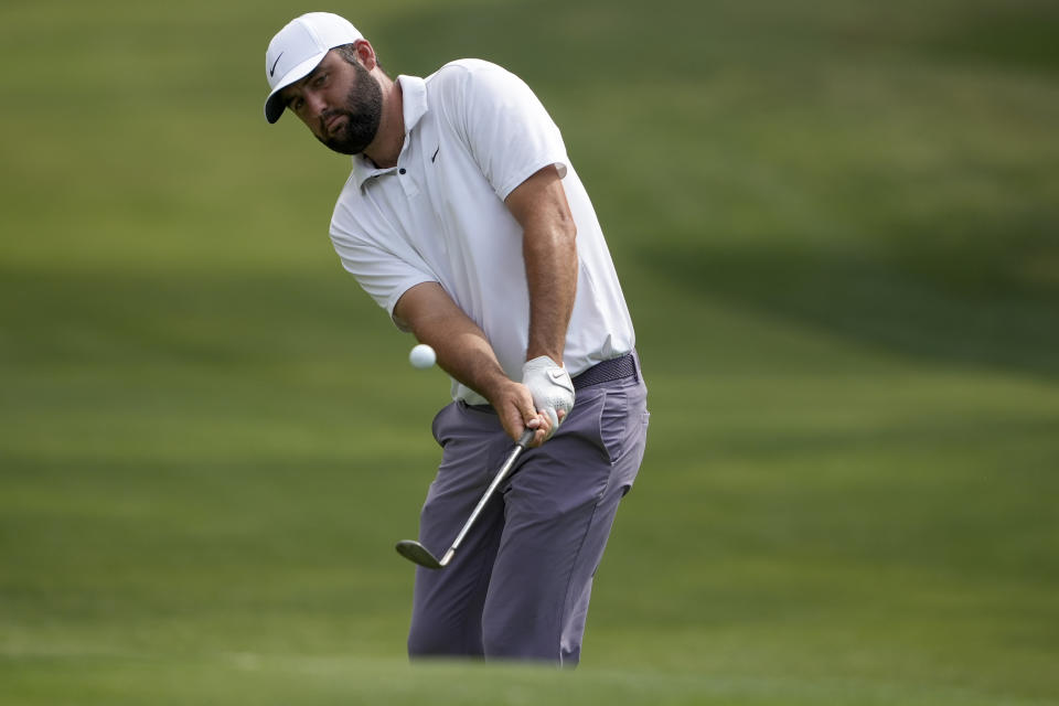 Scottie Scheffler chips to the green on the 15th hole during the third round of the RBC Heritage golf tournament, Saturday, April 20, 2024, in Hilton Head Island, S.C. (AP Photo/Chris Carlson)