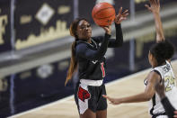 Louisville guard Dana Evans (1) shoots over Wake Forest guard Jewel Spear (24) in the first quarter of an NCAA women's college basketball game in Winston-Salem, N.C., Sunday, Jan. 24, 2021. (AP Photo/Nell Redmond)