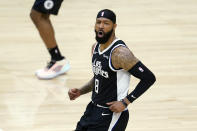 Los Angeles Clippers forward Marcus Morris Sr. reacts after scoring against the Los Angeles Lakers during the first half of an NBA basketball game Sunday, April 4, 2021, in Los Angeles. (AP Photo/Marcio Jose Sanchez)