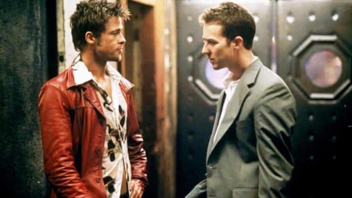 Brad Pitt and Edward Norton standing in front of a door in Fight Club.