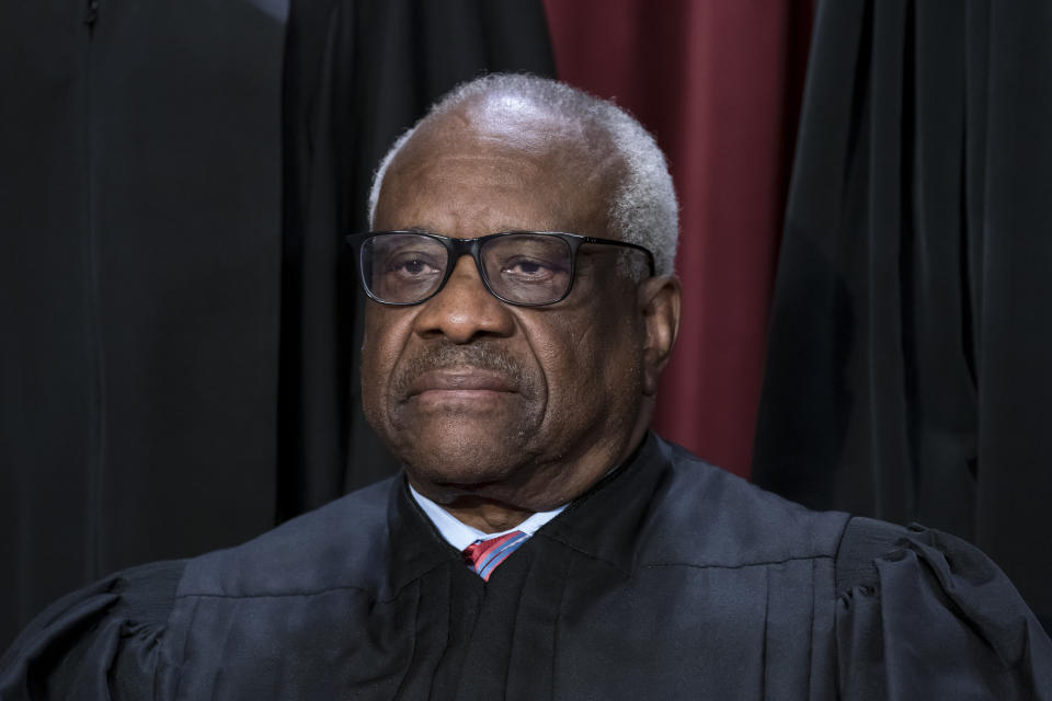 FILE - Associate Justice Clarence Thomas joins other members of the Supreme Court as they pose for a new group portrait, at the Supreme Court building in Washington, Oct. 7, 2022. The Republican majority in the Georgia state senate voted on Tuesday, Feb. 14, 2023, to build a statue of Thomas on the state capitol grounds, despite Democratic opposition to honoring the longtime Supreme Court member and Georgia native. (AP Photo/J. Scott Applewhite, File)