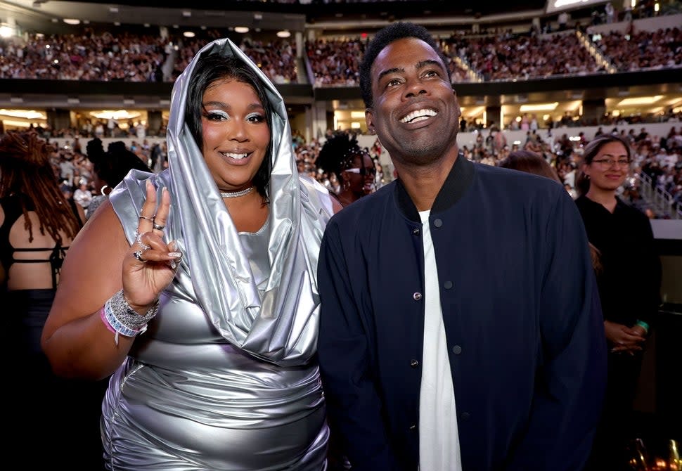 Lizzo and Chris Rock attend the 