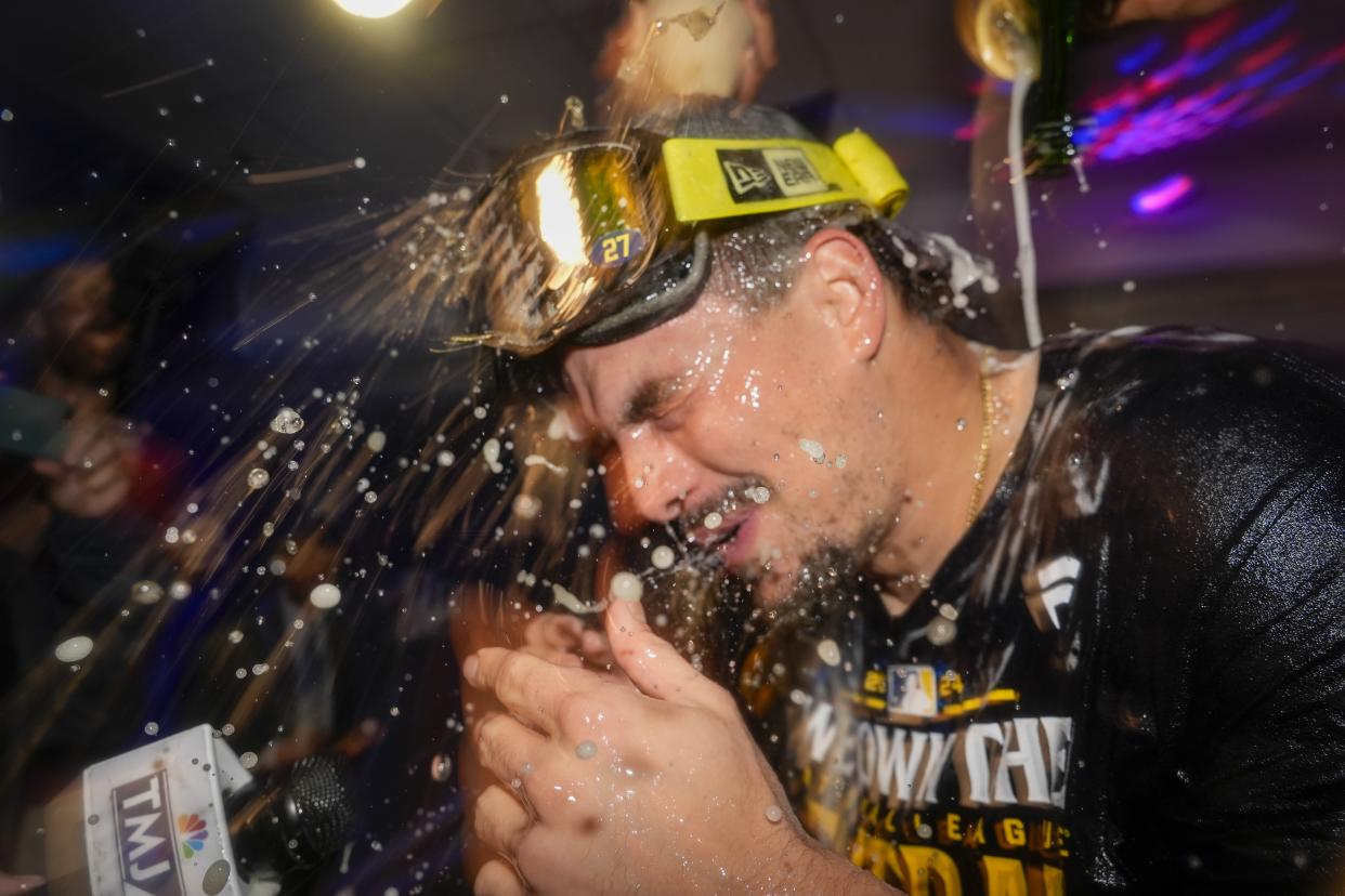 Milwaukee Brewers' Willy Adames is douced after a baseball game against the Philadelphia Phillies Wednesday, Sept. 18, 2024, in Milwaukee. The Brewers won 2-1 and clinched the National League Central division. (AP Photo/Morry Gash)