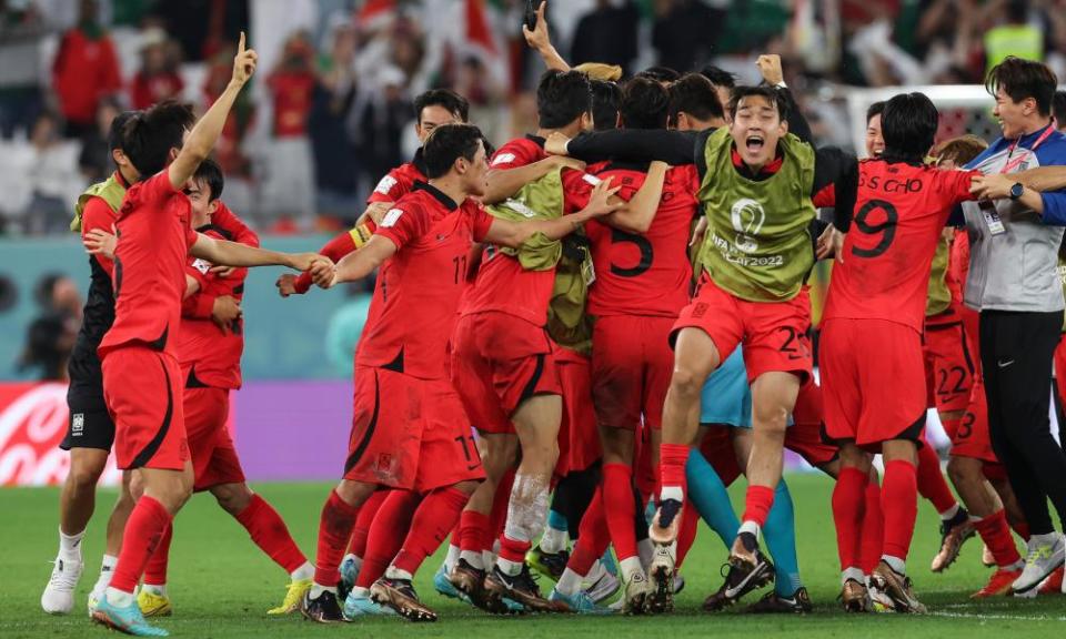 South Korea celebrate reaching the last 16 of the World Cup in Qatar