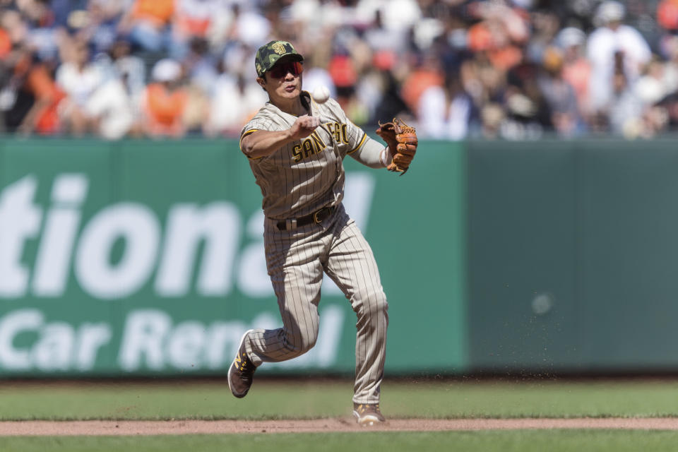 San Diego Padres shortstop Ha-Seong Kim throws to first base for an out against the San Francisco Giants during the seventh inning of a baseball game in San Francisco, Sunday, May 22, 2022. (AP Photo/John Hefti)