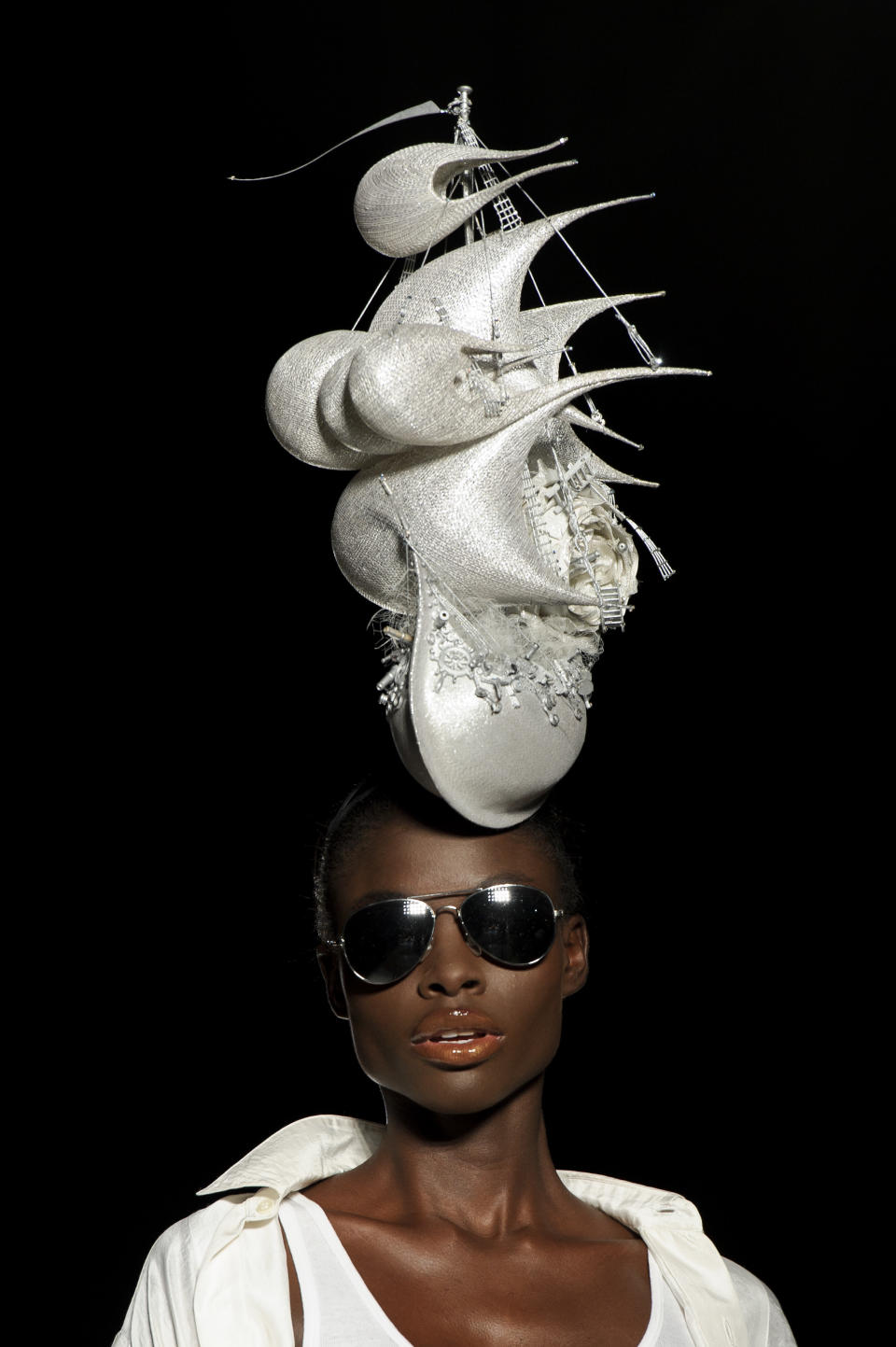 A model wears a design from the Philip Treacy Spring/Summer 2013 collection during London Fashion Week, Sunday, Sept. 16, 2012. (AP Photo/Jonathan Short)