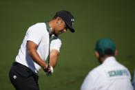 Xander Schauffele hits on the practice range during a practice round in preparation for the Masters golf tournament at Augusta National Golf Club Monday, April 8, 2024, in Augusta, Ga. (AP Photo/Matt Slocum)