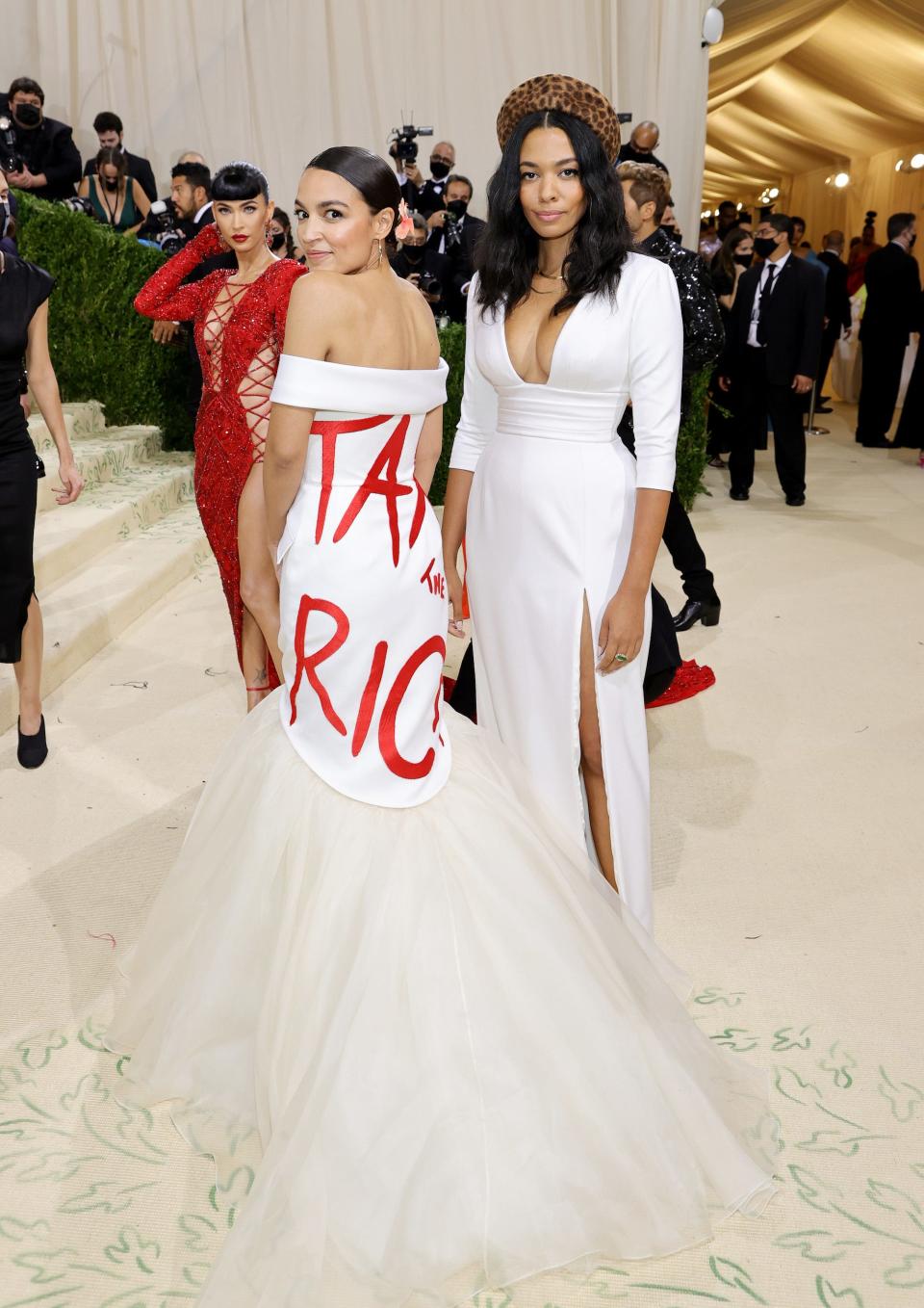 A photo a Democratic Rep. Alexandria Ocasio-Cortez wearing a dress with the phrase, "Tax the Rich" on it."