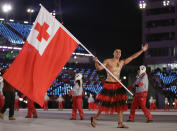 <p>Pita Taufatofua carries the flag of Tonga during the opening ceremony of the 2018 Winter Olympics in Pyeongchang, South Korea, Friday, Feb. 9, 2018. (AP Photo/Vadim Ghirda) </p>