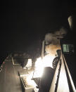 In this image provided by the U.S. Navy, the USS Ross (DDG 71) fires a tomahawk land attack missile Friday, April 7, 2017, from the Mediterranean Sea. The United States blasted a Syrian air base with a barrage of cruise missiles in fiery retaliation for this week's gruesome chemical weapons attack against civilians. (Mass Communication Specialist 3rd Class Robert S. Price/U.S. Navy via AP)