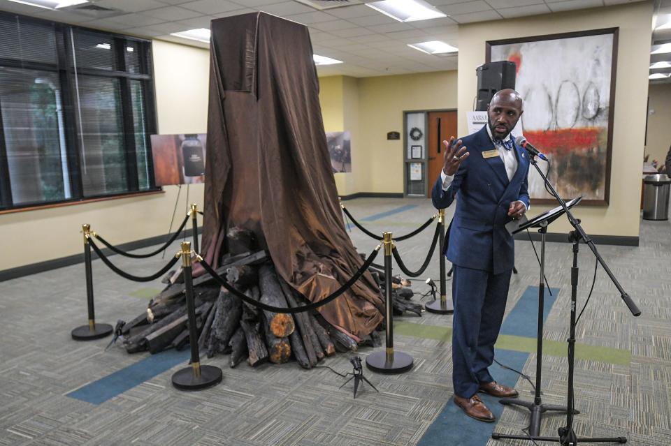 Dr. James Noble, Vice President for Diversity, Community, and Inclusion speaks to a crowd on the second floor of the Thrift Library for the unveiling of his art sculpture, during the Remembrance and Reconciliation art revealed event at Anderson University Thursday, September 21, 2023. The art made of wood, metal, glass, and soil at the fourth stop of a tour around Anderson County.