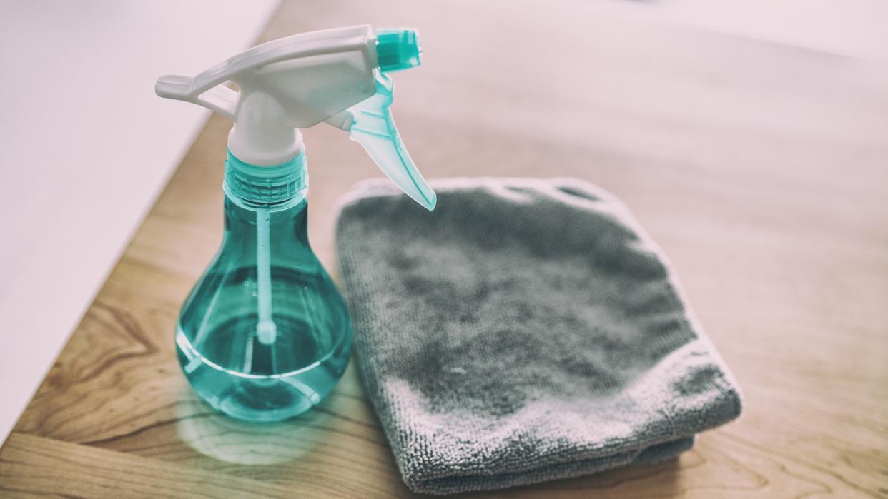 Surface cleaning home kitchen All purpose cleaner disinfectant spray bottle with towel to clean high touch surfaces from COVID-19 virus contagion.