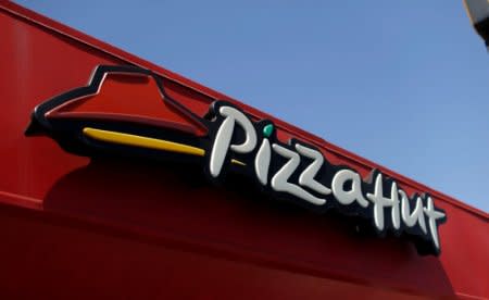 The sign at a Pizza Hut location, which is owned by Yum Brands Inc, is pictured ahead of their company results in Pasadena, California U.S., July 11, 2016. REUTERS/Mario Anzuoni