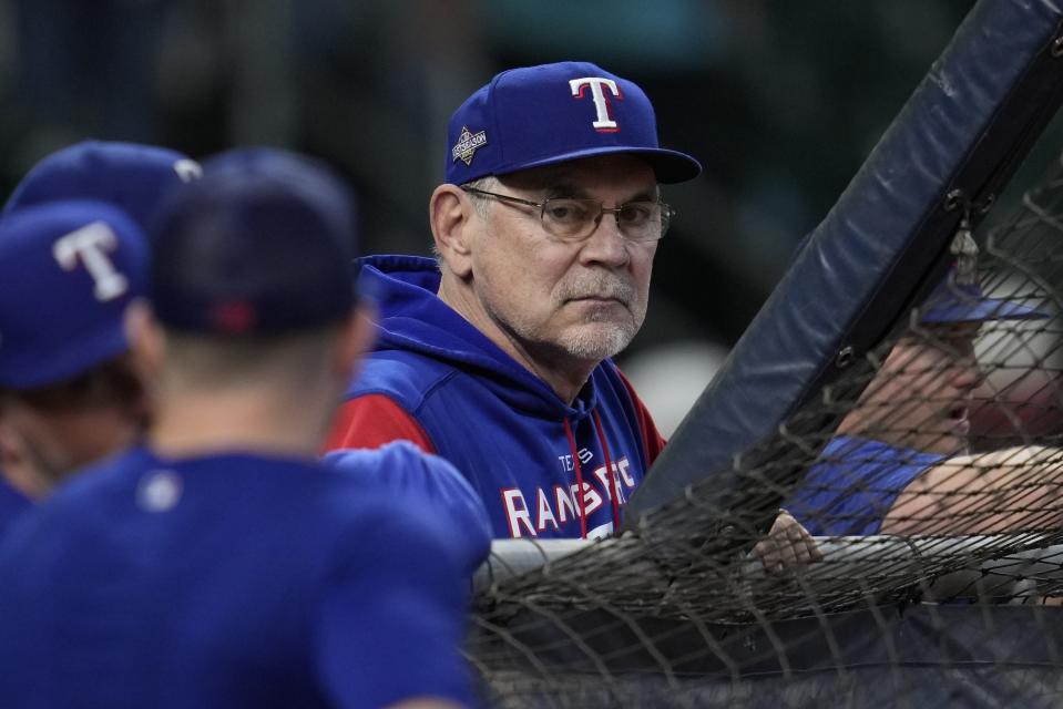 Texas Rangers manager Bruce Bochy watches batting practice before Game 7 of the baseball AL Championship Series against the Houston Astros Monday, Oct. 23, 2023, in Houston. (AP Photo/Godofredo A. Vásquez)