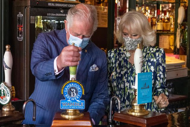 The then Prince of Wales pulling a pint during a visit to the Prince of Wales pub in Clapham, south London in 2021.