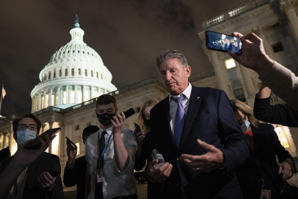 Sen. Joe Manchin (D-WV) and Â Director of the U.S. Domestic Policy CouncilÂ Susan Rice exit a closed-door meeting at the U.S. Capitol on September 30, 2021 in Washington, DC. (Drew Angerer/Getty Images)