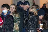 President Joe Biden is hugged by his son Hunter Biden as they attend the annual Christmas Tree Lighting ceremony with first lady Jill Biden and family, Friday, Nov. 26, 2021, in Nantucket, Mass. (AP Photo/Carolyn Kaster)