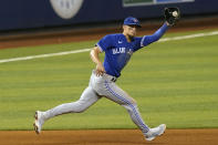 Toronto Blue Jays third baseman Cavan Biggio (8) catches a hit by Miami Marlins Jesus Aguilar during the eighth inning of a baseball game, Wednesday, June 23, 2021, in Miami. (AP Photo/Marta Lavandier)