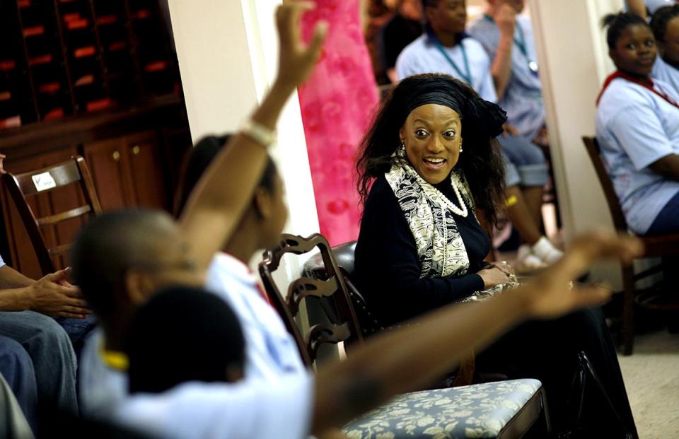 A photo from May 2008 shows the late Jessye Norman listening to students talk about their activities at the Jessye Norman School of the Arts.