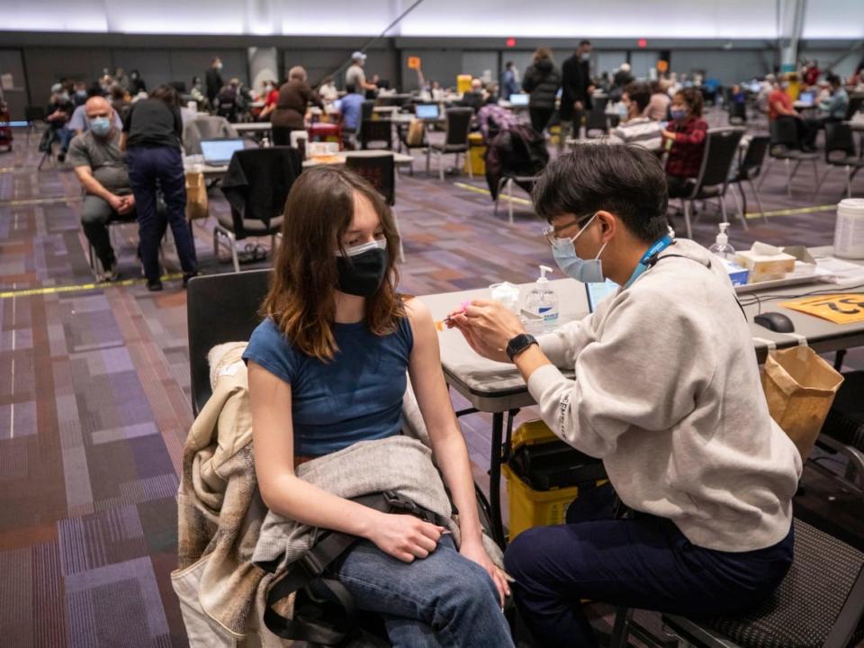 A COVID-19 vaccination clinic at the Vancouver Convention Centre in Vancouver, British Columbia on Thursday, Jan. 13, 2022.  (Ben Nelms/CBC - image credit)