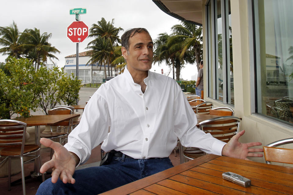 FILE - in this Wednesday, March 7, 2012 file photo, Fane Lozman talks to a reporter in Miami Beach, Fla. Lozman beat long odds just getting his case to the U.S. Supreme Court, which agreed in January 2013 that his floating home was a house and wasn’t a vessel subject to seizure by a Florida city that destroyed it. Now Lozman is asking the nation’s highest court to welcome the case back into its port anew and order the city to reimburse him the estimated $165,000 value of the home, plus legal fees. (AP Photo/Alan Diaz, File)