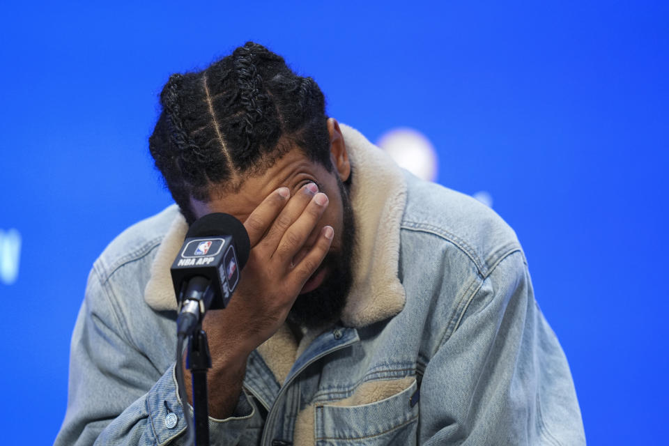 Miami Heat's Gabe Vincent reacts while talking to reporters after Game 1 of the basketball team's NBA Finals against the Denver Nuggets, Thursday, June 1, 2023, in Denver. (AP Photo/Jack Dempsey)