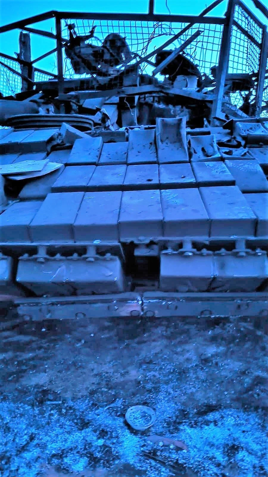 A Ukrainian T-64 tank with protective armor that was damaged in combat in April 2024.