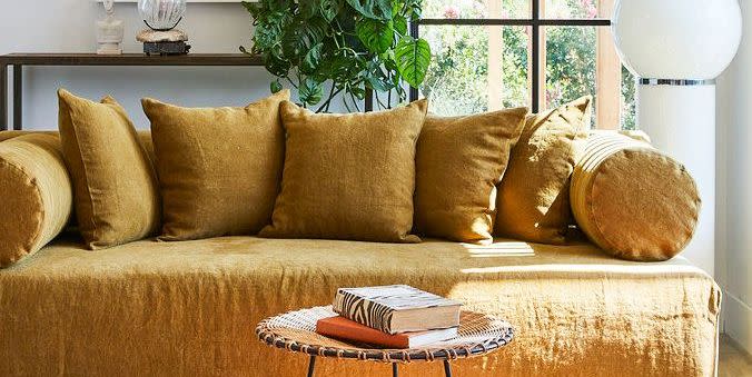 mustard yellow slipcovered sofa