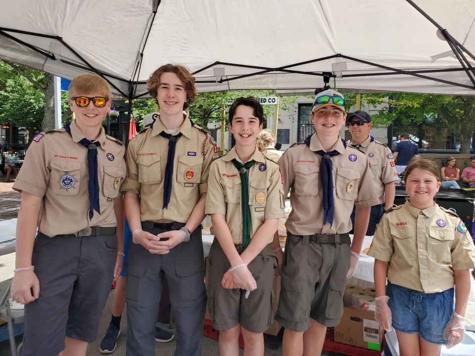 Troop 164 Boy Scouts, from left, including Andrew Franas, Gregory Riddle, John Riddle and Ian Franas, are seen Saturday, June 11, 2022, at Market Square Day in Portsmouth.