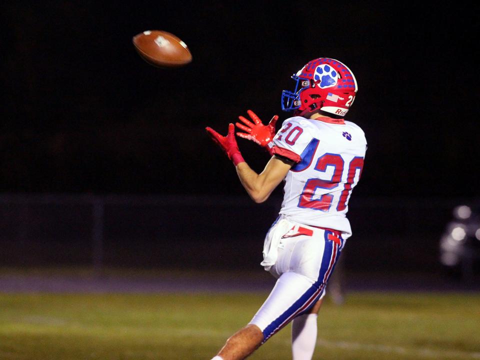 Licking Valley's Jacob Wheeler catches a touchdown pass against East on Friday.