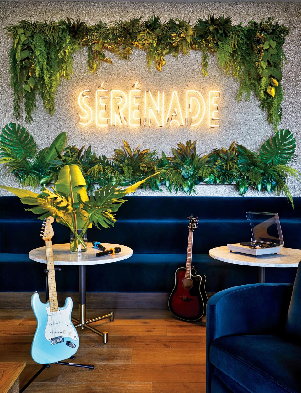 The Sérénade Karaoke room features a bespoke neon sign designed by V Starr. Wall covering by Phillip Jeffries; custom Banquette and Fama chairs in a Brentano velvet.