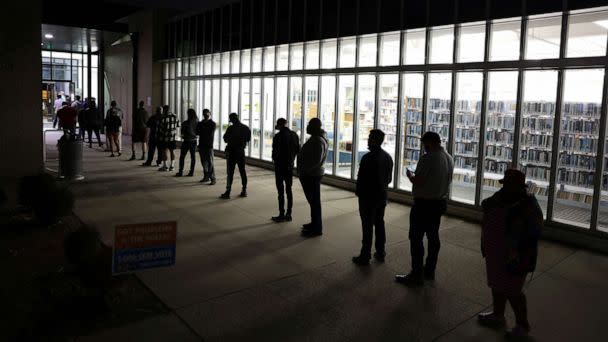 PHOTO: Residents wait in line to vote early outside a polling station, Nov. 29, 2022 in Atlanta. (Alex Wong/Getty Images)
