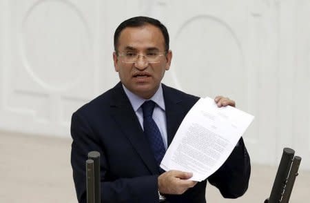 Justice Minister Bekir Bozdag addresses the Turkish Parliament during a debate in Ankara in this March 19, 2014 file photo. REUTERS/Umit Bektas/Files