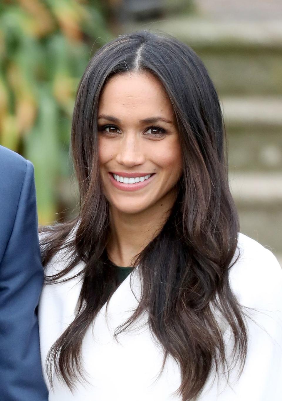 Meghan looking radiant at the announcement of her engagement in 2017