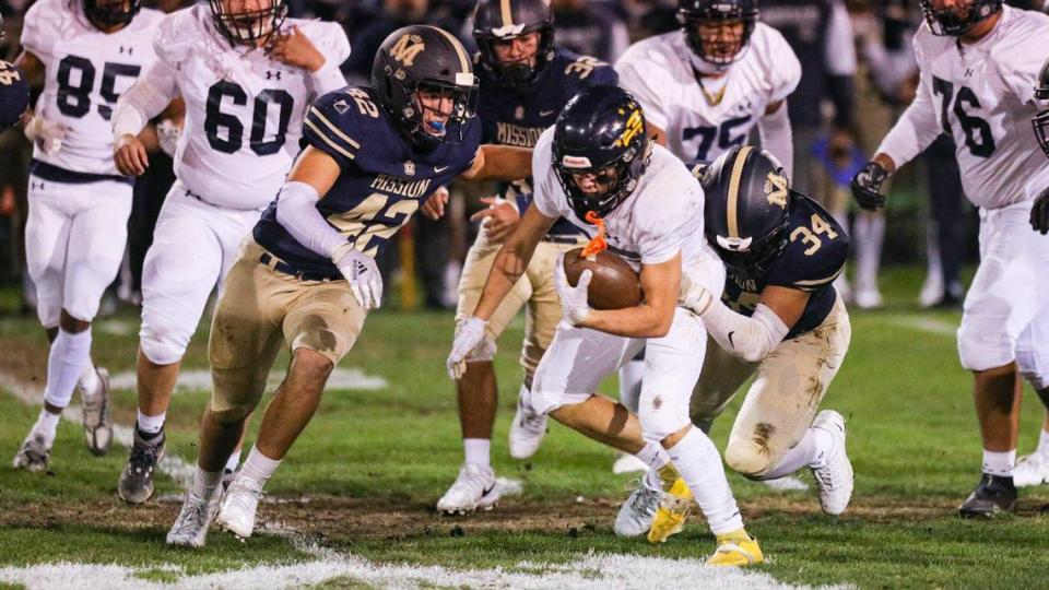 Junior Herlihy is pursued by David Luera and Mario Luera. Mission Prep beat Arroyo Grande 35-14 in second-round CIF Central Section football playoff game on Nov. 10, 2022.