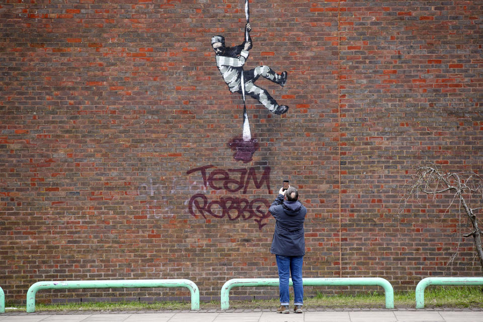 <p>The Banksy artwork which was painted on the side of the former prison in Reading has now been defaced. Picture date: Tuesday March 16, 2021. (Photo by Steve Parsons/PA Images via Getty Images)</p>
