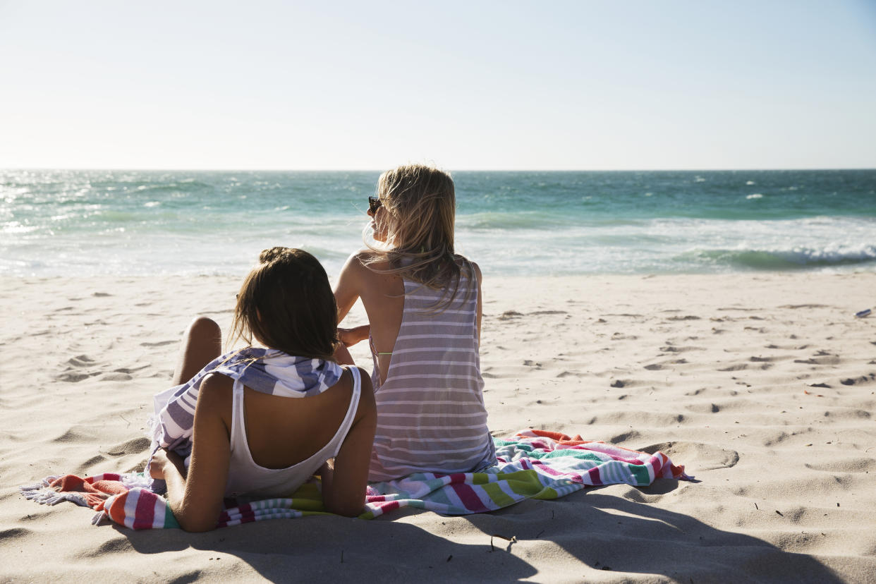 Young women on a beach. Image: Getty