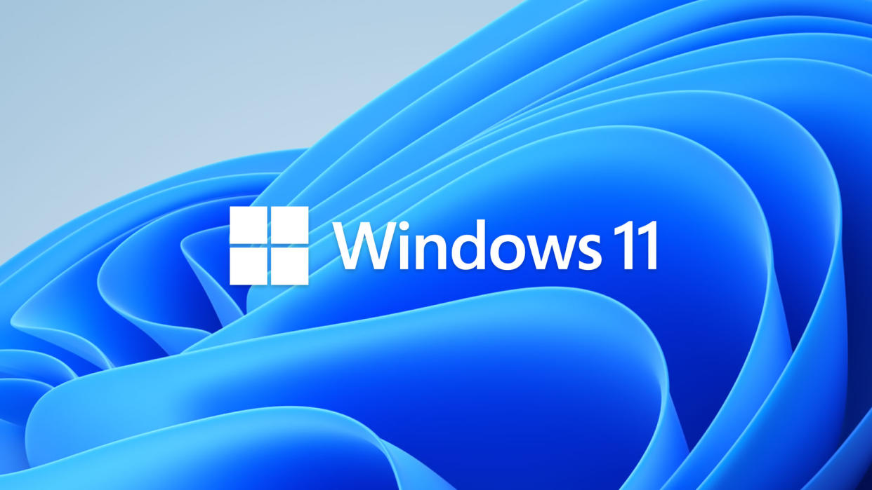  Windows 11 logo on a blue, folded backdrop. 