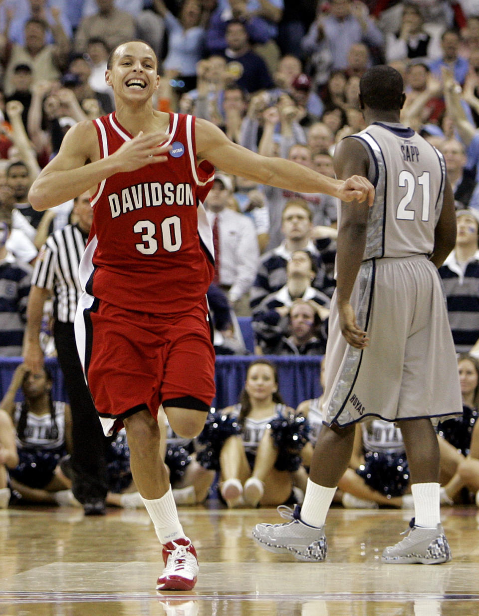 FILE - Davidson's Stephen Curry (30) celebrates as Georgetown's Jessie Sapp (21) walks away following Davidson's 74-70 win in a second-round NCAA Midwest Regional basketball game in Raleigh, N.C., Sunday, March 23, 2008. Curry lead Davidson with 30 points. (AP Photo/Chuck Burton, File)