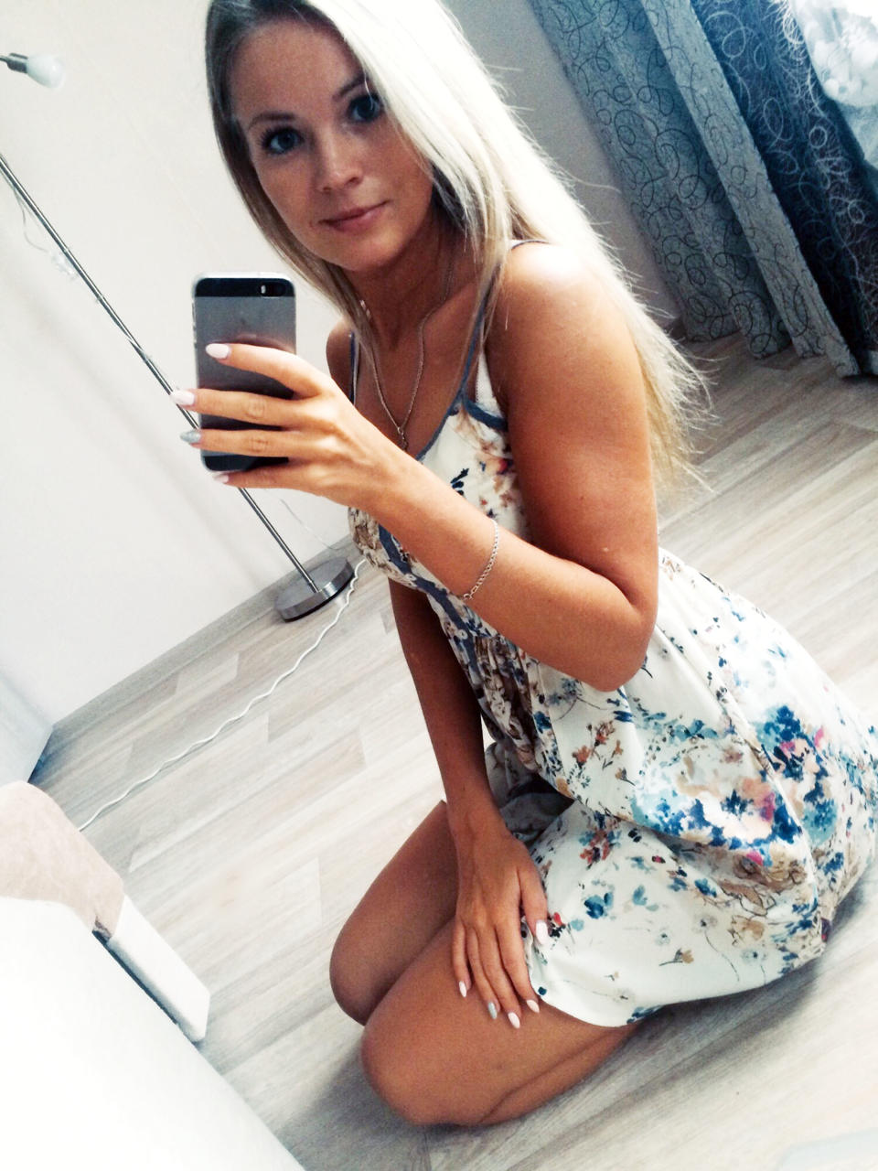 Russian accountant Evgenia Shulyatyeva (pictured in a selfie here) was killed after she was electrocuted by a charging phone that is believed to have fallen in the bath. 