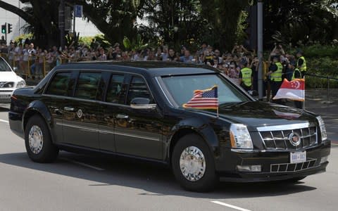 Mr Trump heading to the summit in 'The Beast' - Credit: AP