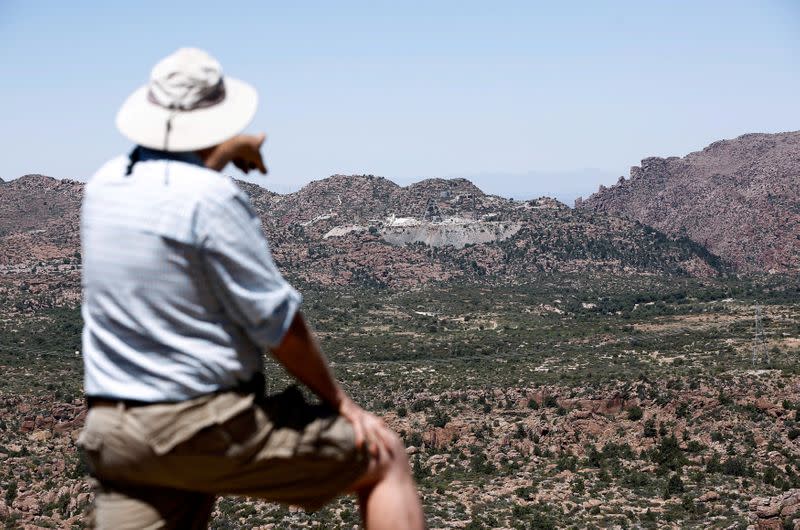 FILE PHOTO: FILE PHOTO: Featherstone of the Arizona Mine Reform Coalition points to Resolution Copper mine in the Oak Flat area near Superior, Arizona