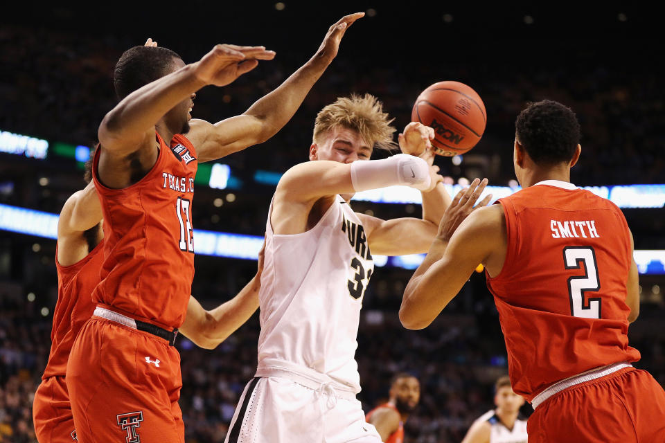 Texas Tech defenders swarm Purdue’s Matt Haarms during Friday’s Sweet 16 game in Boston. (Getty)