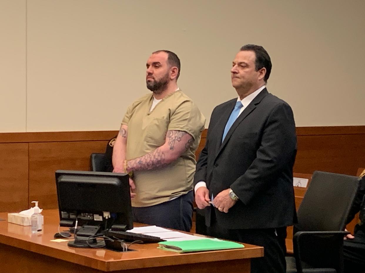 Ricky D. Jobe II, 38, of Columbus' South Side, (left) who appeared Wednesday in Franklin County Common Pleas Court with his attorney, Paul Scott, (left) pleaded guilty to voluntary manslaughter and aggravated burglary in connection with the 2021 fatal shooting of 38-year-old Darold Reese in the city's Merion Village neighborhood.